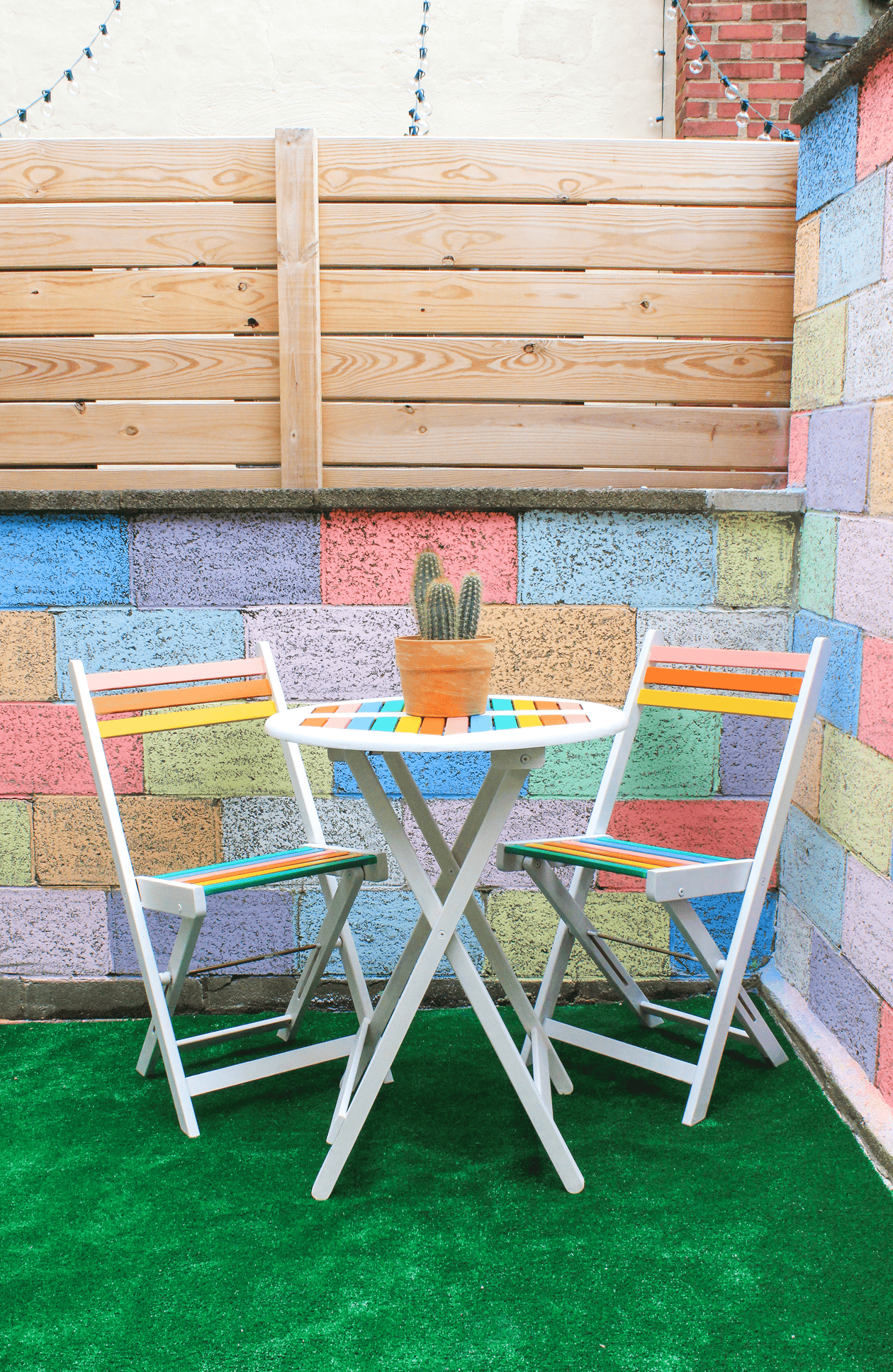 With just a bit of paint, you can make a cheap bistro set feel like you're in Palm Springs! Add a little rainbow to your patio decor with this DIY Table Makeover!
