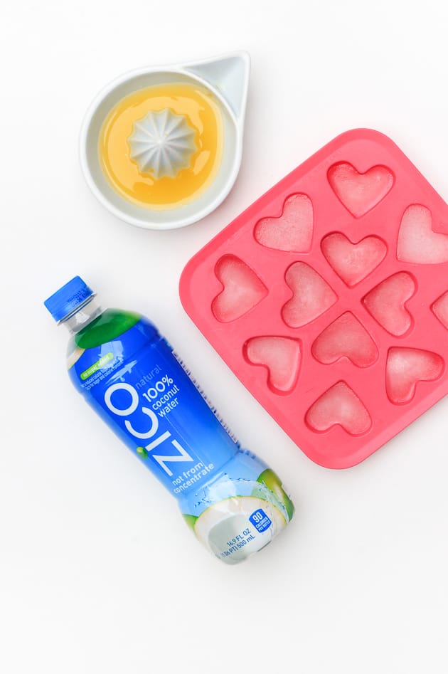 For an extra adorable touch, make make your own coconut water heart shaped ice cubes. Just pour the water in the mold (found mine at Ikea) and chill overnight. Fresh pineapple on a skewer is also a fun way to serve fruit!