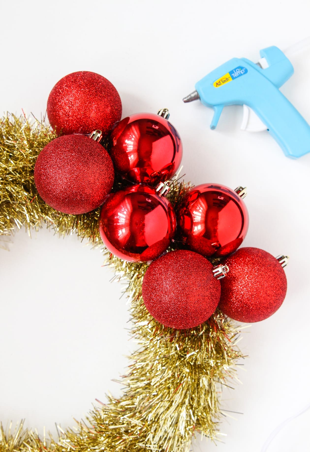 diy-Ornament-wreath-2 Glueing ornaments onto a wreath frame to make an ornament wreath