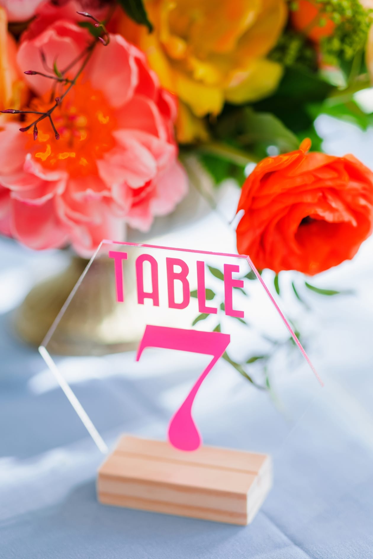 Learn how to make your own colorful wedding decor with this table number download! Grab the SVG file then start crafting your wedding decor today!