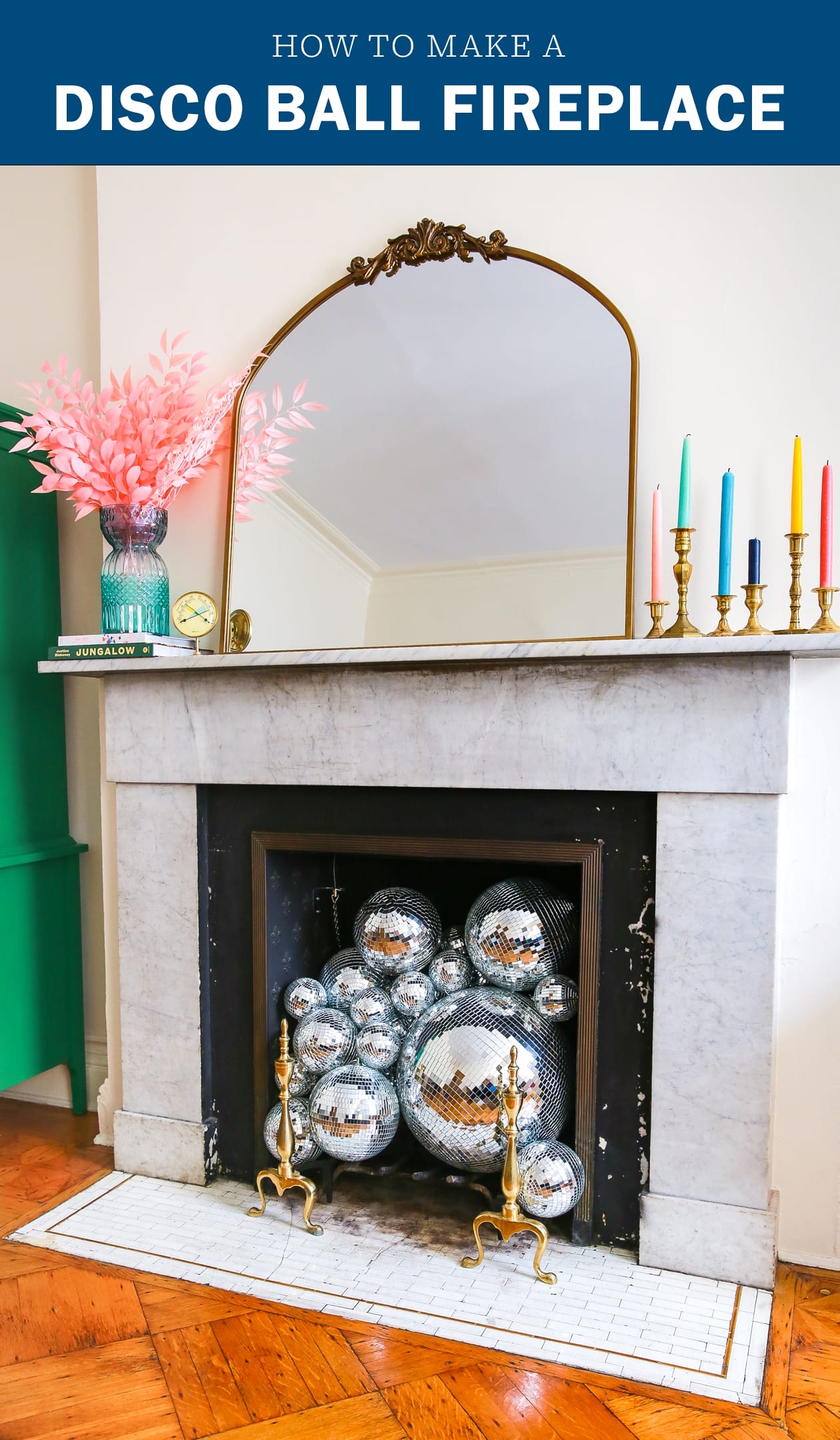 Disco balls in fireplace of a historic home. Tope styled with a mirror, faux flowers, and rainbow taper candles 
