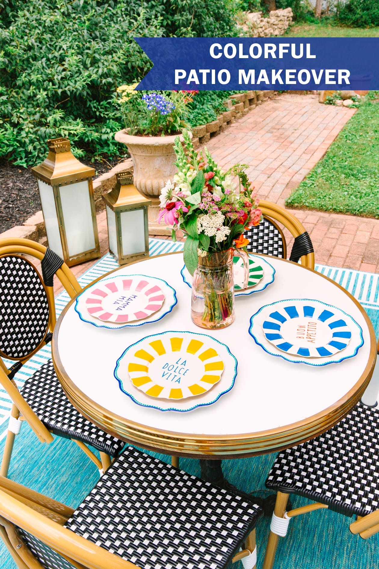 Colorful patio makeover.  Patio table set with dishes and flowers.