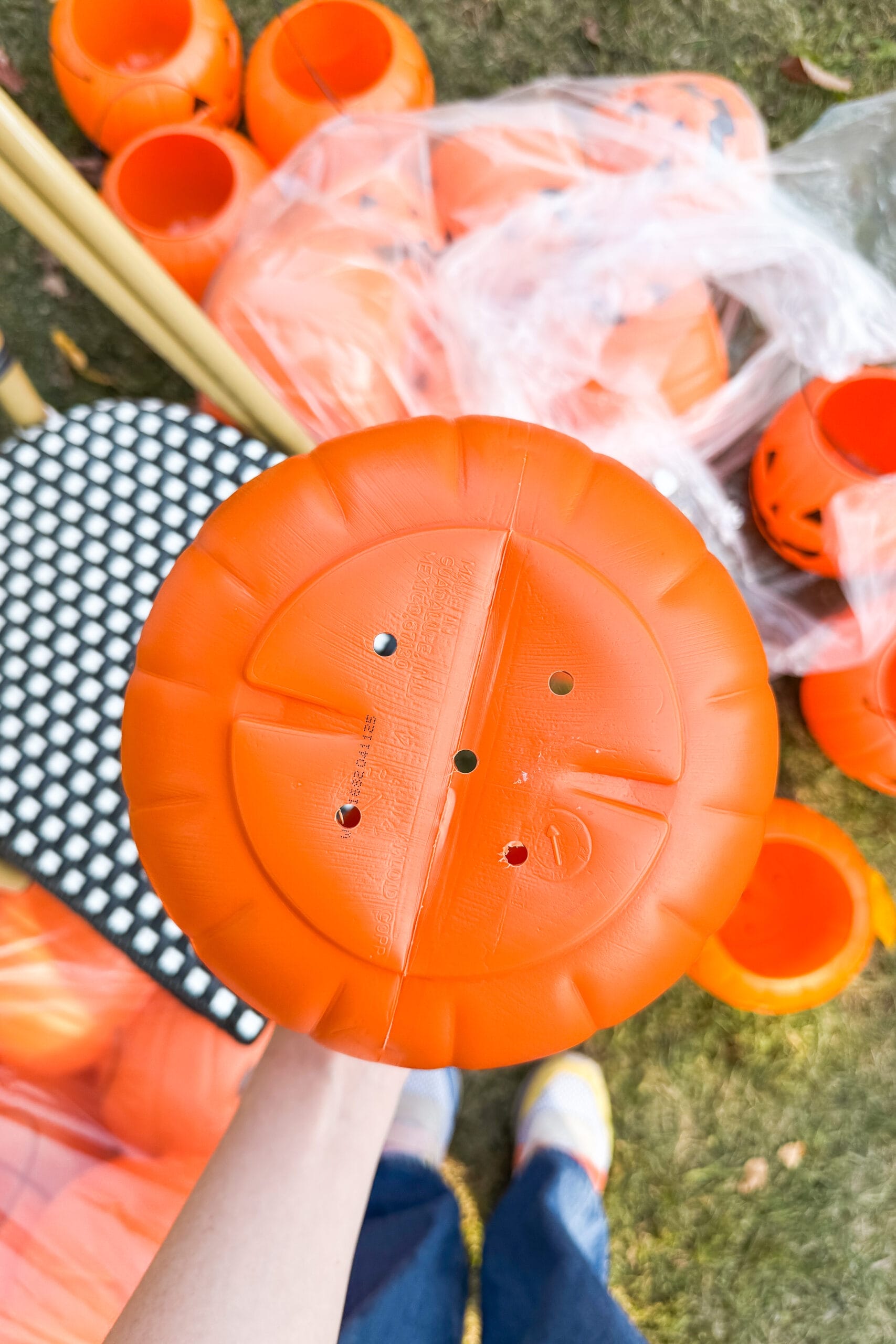 IMG_3559 2 Pumpkin buckets with holes drilled in the bottom so they can hang in a tree for Halloween decor