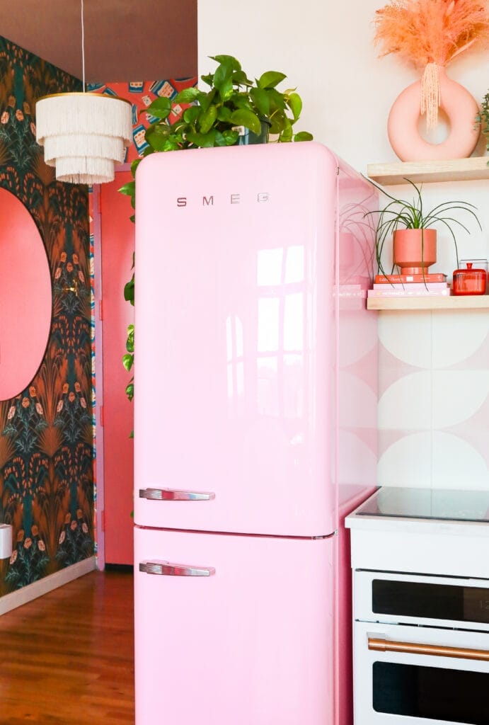 colorful kitchen with pink fridge